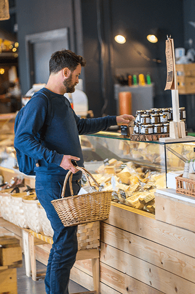 man shopping at a local store in Canary Wharf